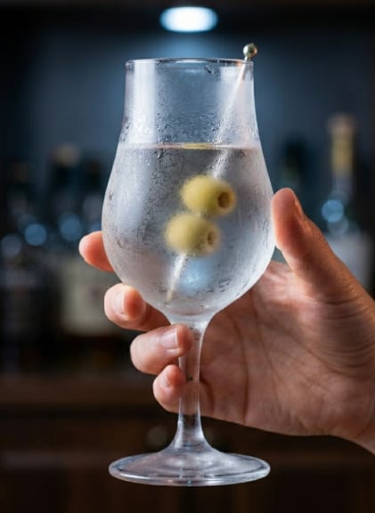 A whisky highball or straight-up cocktail in a pre-chilled glass