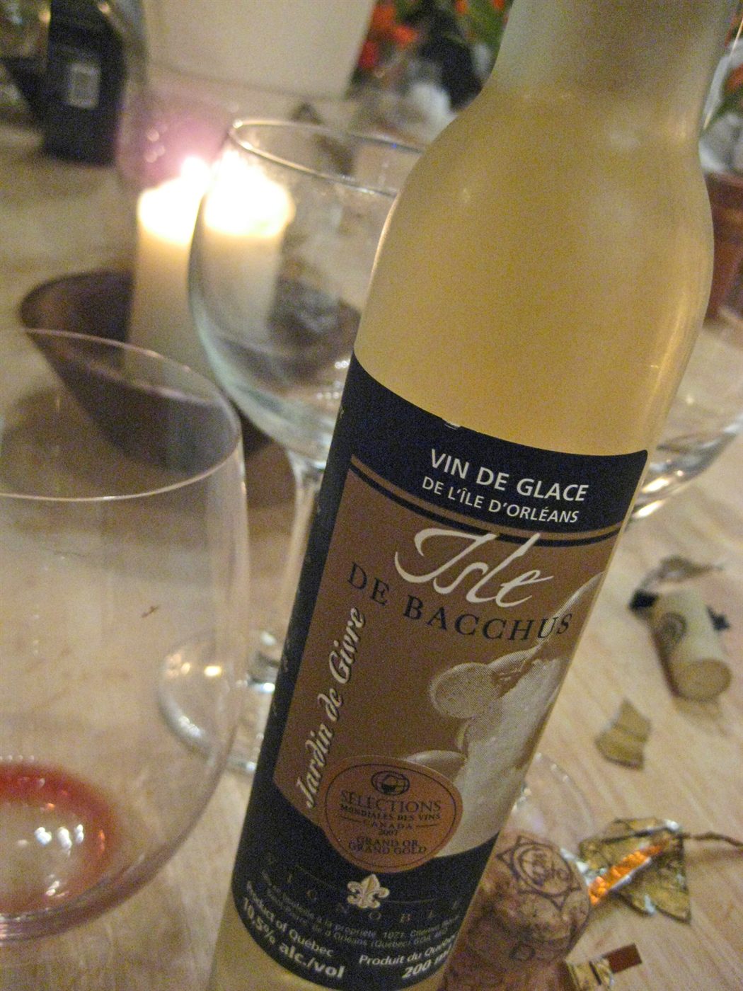 A small, narrow dessert-wine glass with a little golden icewine pooled at the bottom