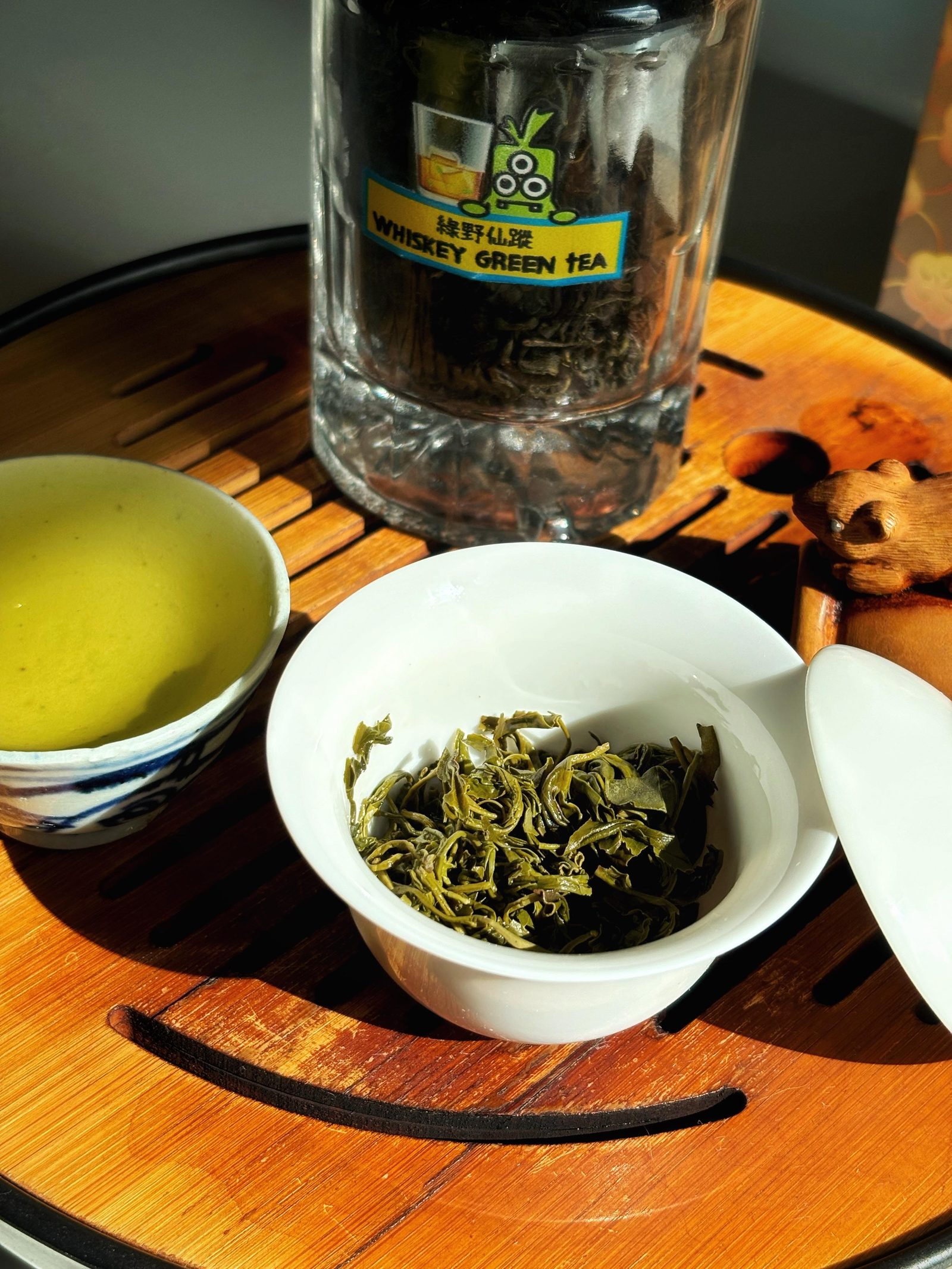 A glass of whisky mixed with chilled green tea