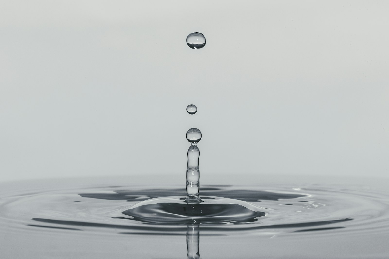 A single drop of water falling into whisky